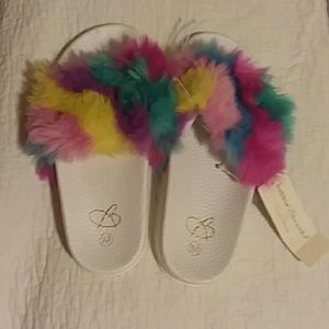 Girls slip on feather sandals.